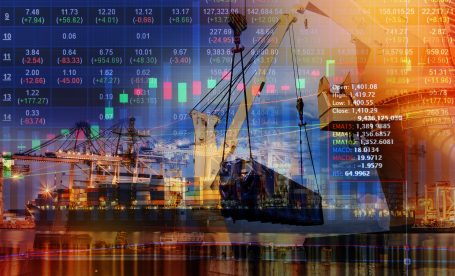 Double exposure of stocks market chart concept with International Container Cargo ship in the ocean